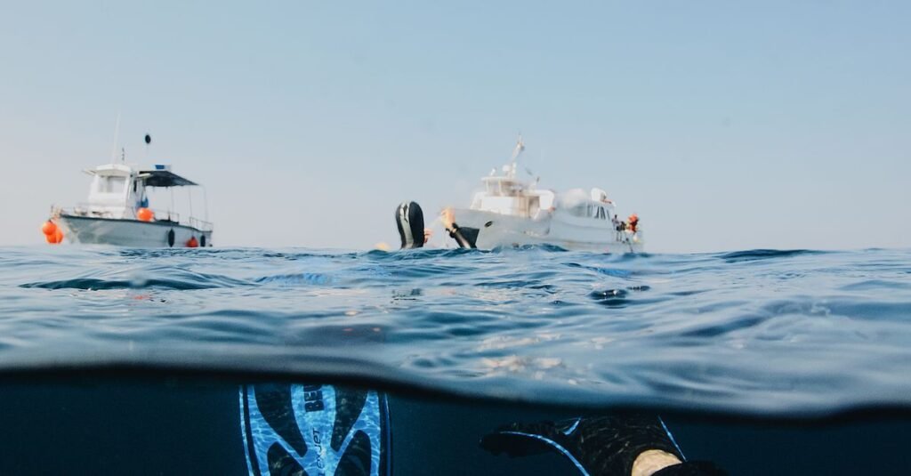Experience the thrill of scuba diving near yachts in the open ocean. Ideal for adventure seekers.